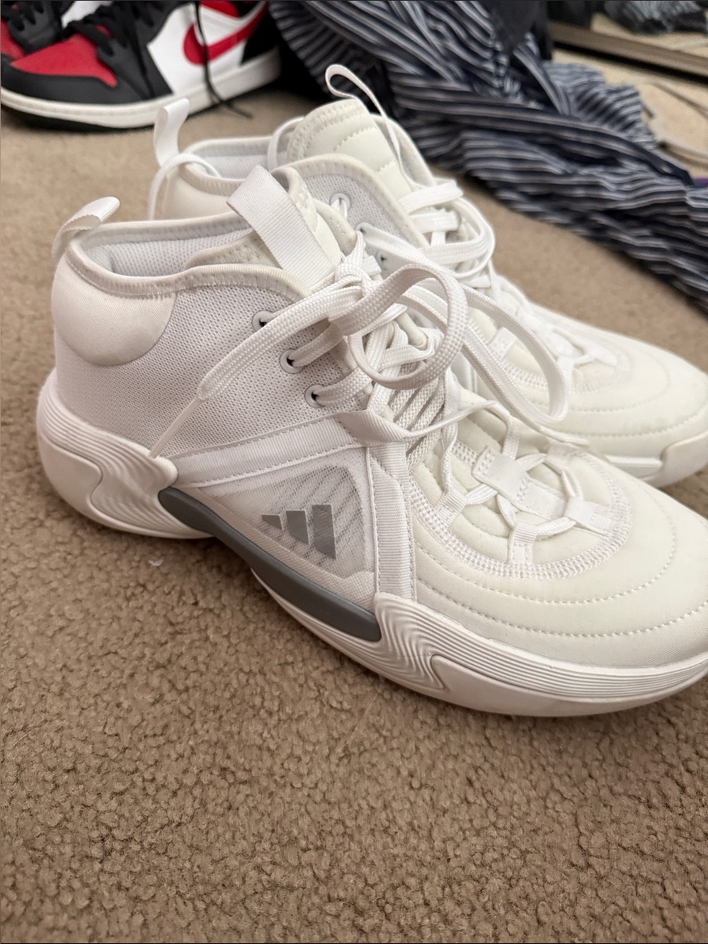 adidas White Athletic Shoes exhibit select mid white silver metallic.